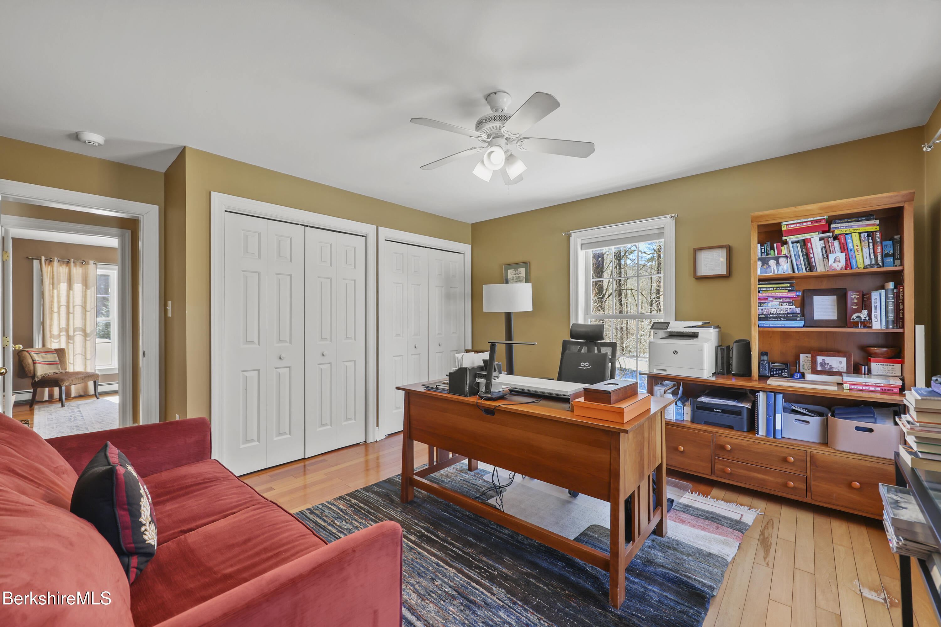 130 East Dugway Road Lenox, MA 01240 - Photo 47 of 89 a bedroom with furniture and a book shelf