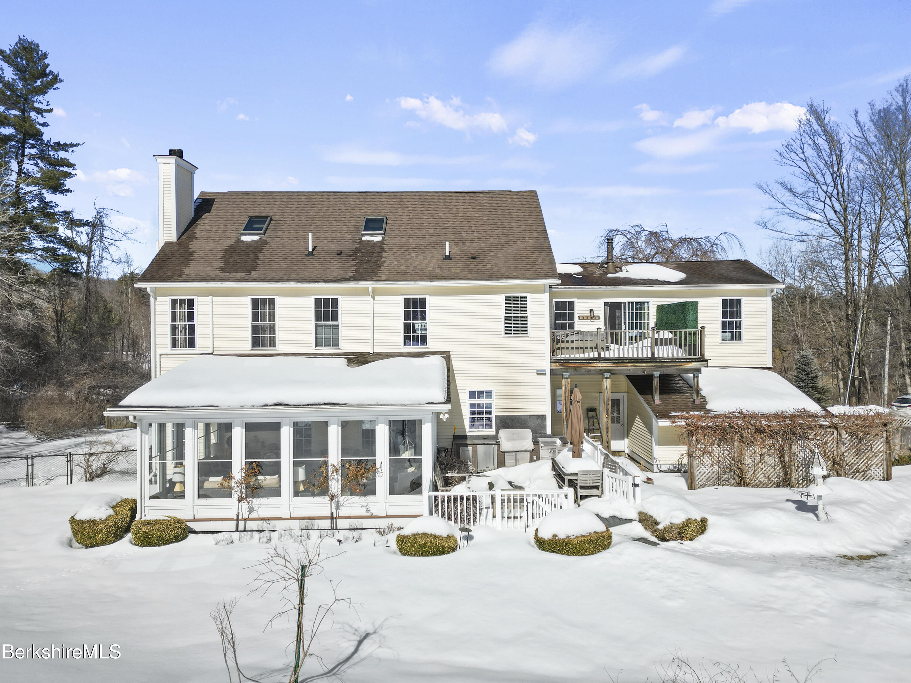 130 East Dugway Road Lenox, MA 01240 - Photo 57 of 89 a view of a white house with couches in front of it