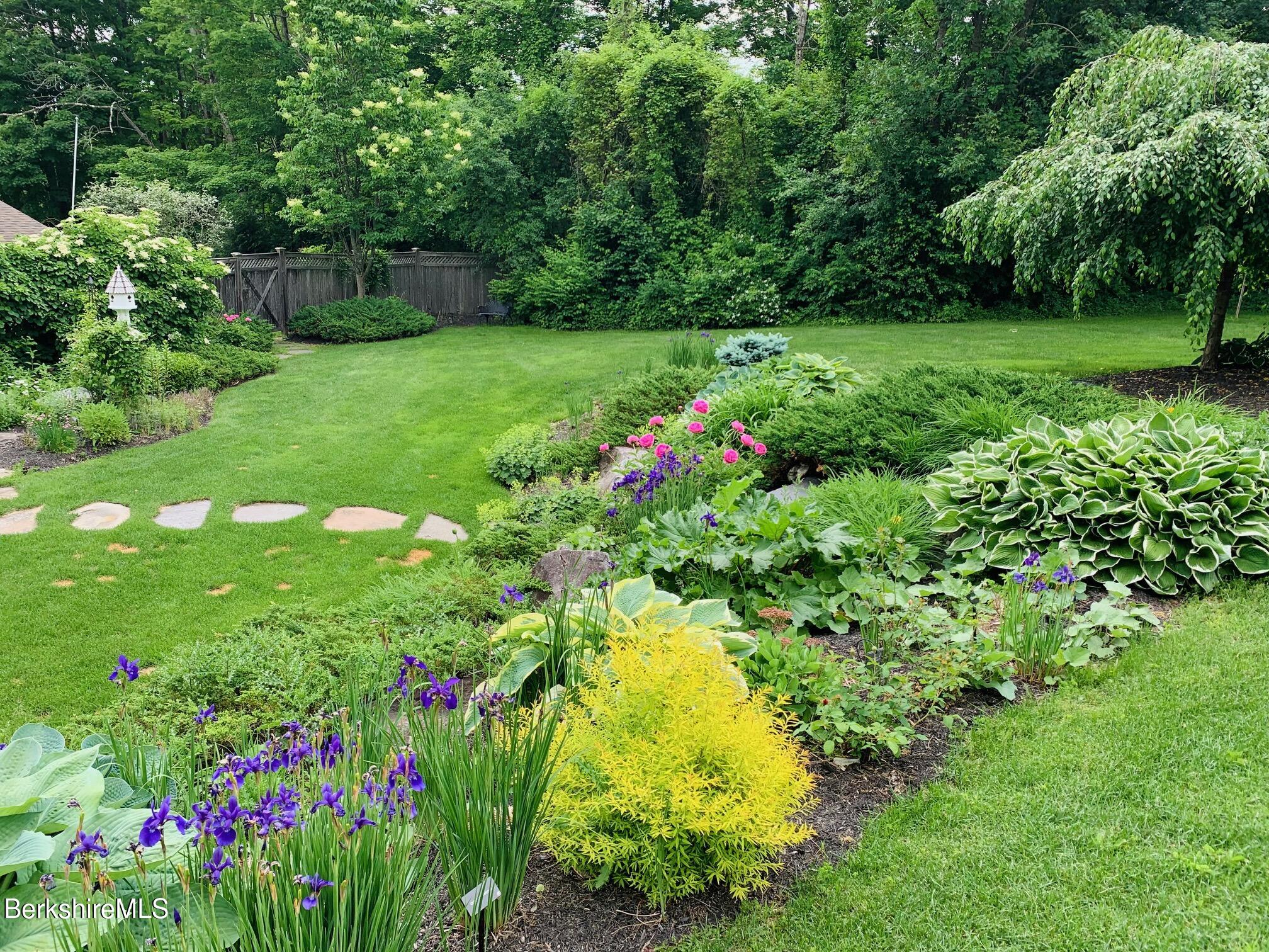 130 East Dugway Road Lenox, MA 01240 - Photo 70 of 89 a view of a garden with plants and large trees