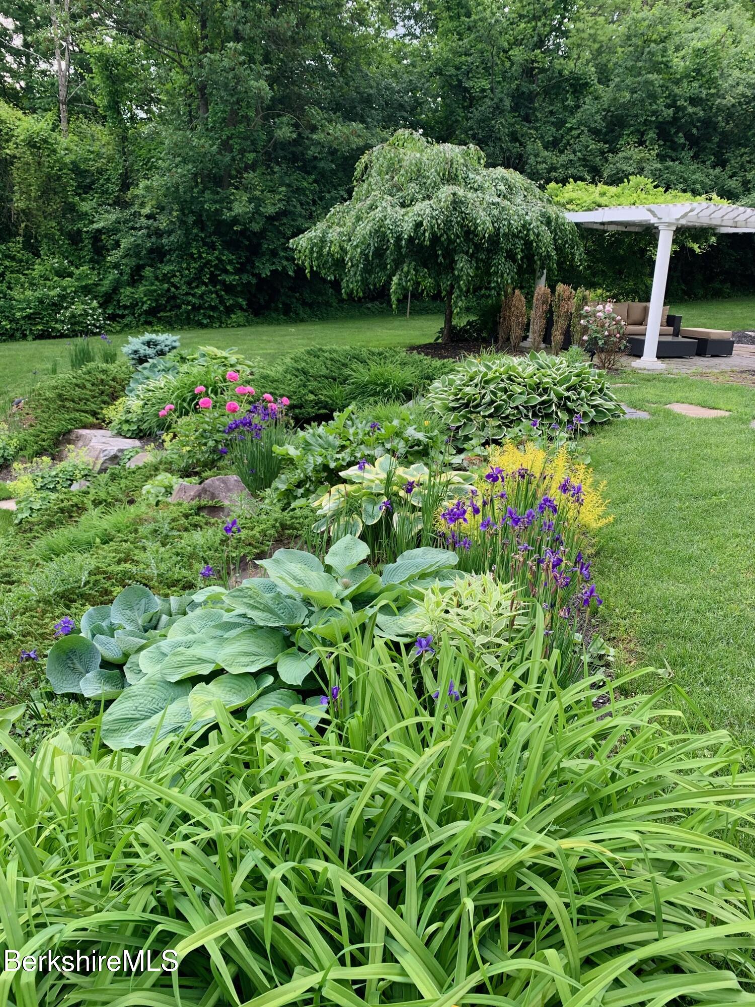 130 East Dugway Road Lenox, MA 01240 - Photo 71 of 89 a view of a garden with a fountain