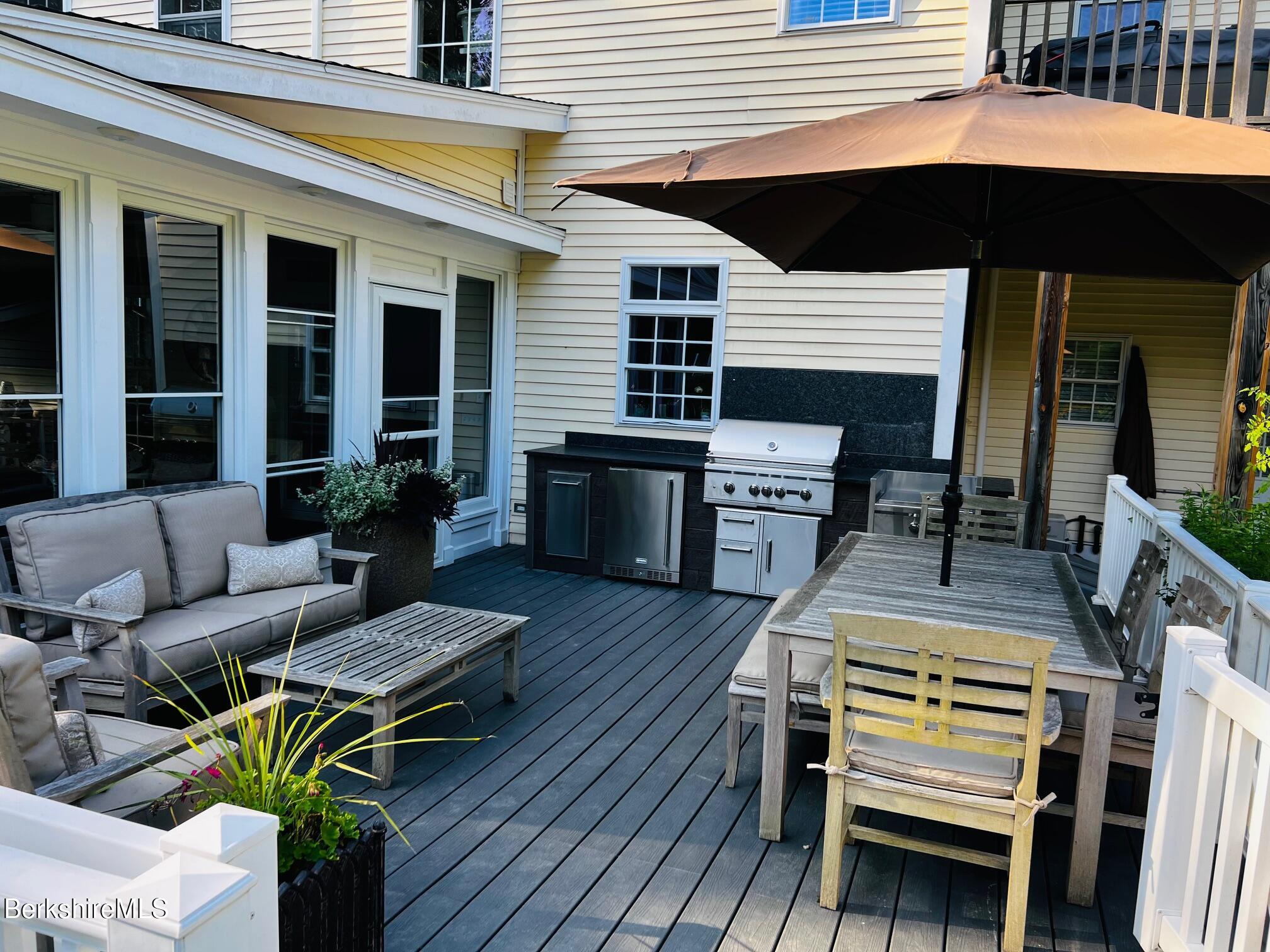 130 East Dugway Road Lenox, MA 01240 - Photo 88 of 89 a view of a dinning tables and chair in the balcony