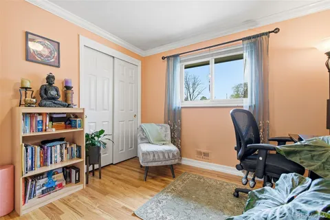 a workspace with furniture and a book shelf