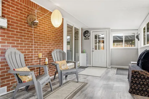 a view of a door with chair and couch