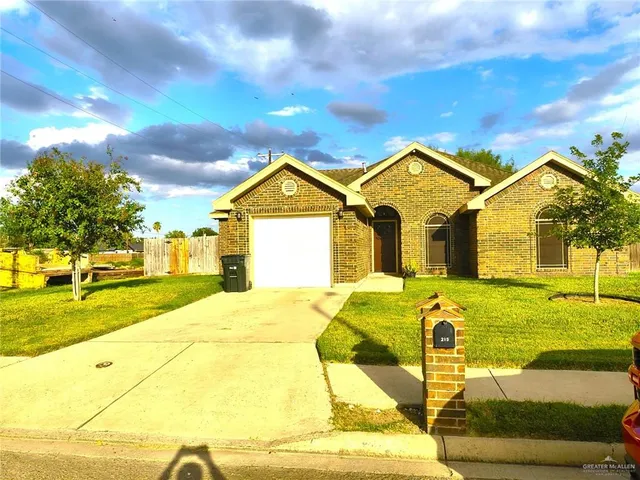 a front view of a house with yard