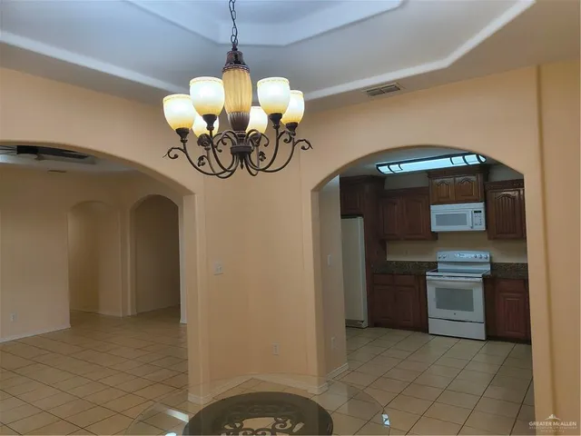 a view of a kitchen with a sink and a stove top oven