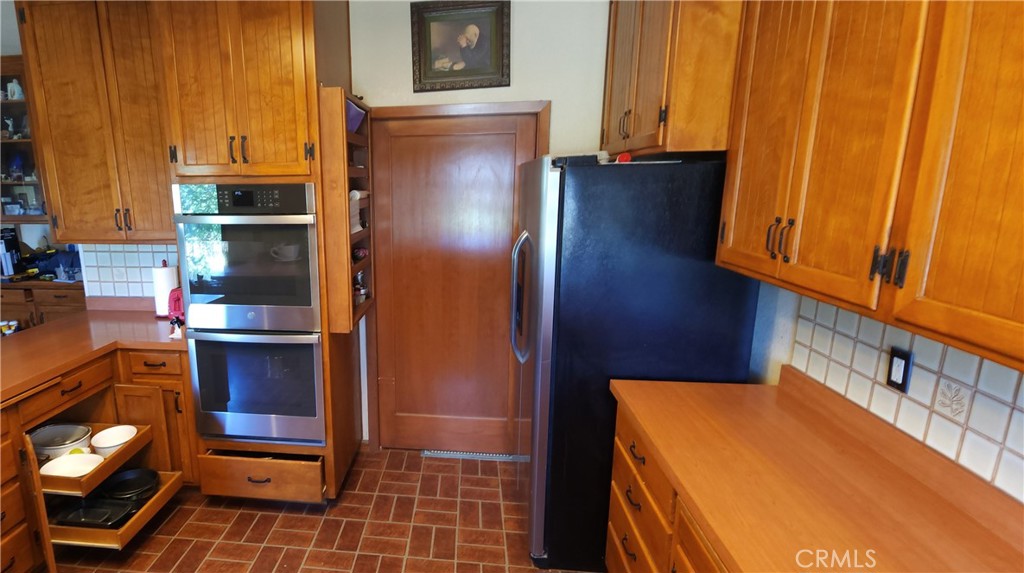 25205 5th Avenue Los Molinos, CA 96055 - Photo 15 of 37 a kitchen with stainless steel appliances granite countertop a refrigerator and a stove