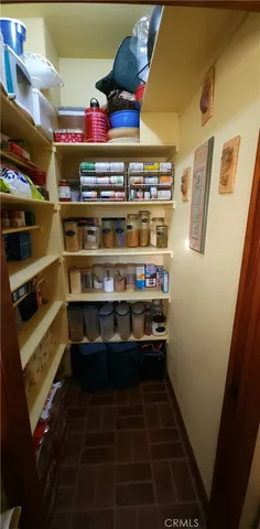a view of a living room with furniture and a flat screen tv