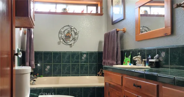 a bathroom with a bathtub and a sink