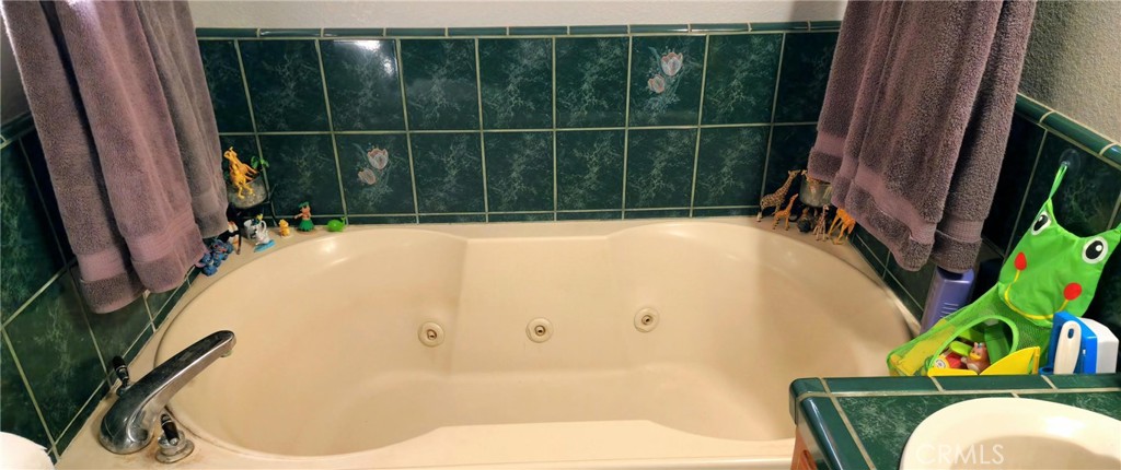 25205 5th Avenue Los Molinos, CA 96055 - Photo 22 of 37 a bathroom with a bathtub and a sink