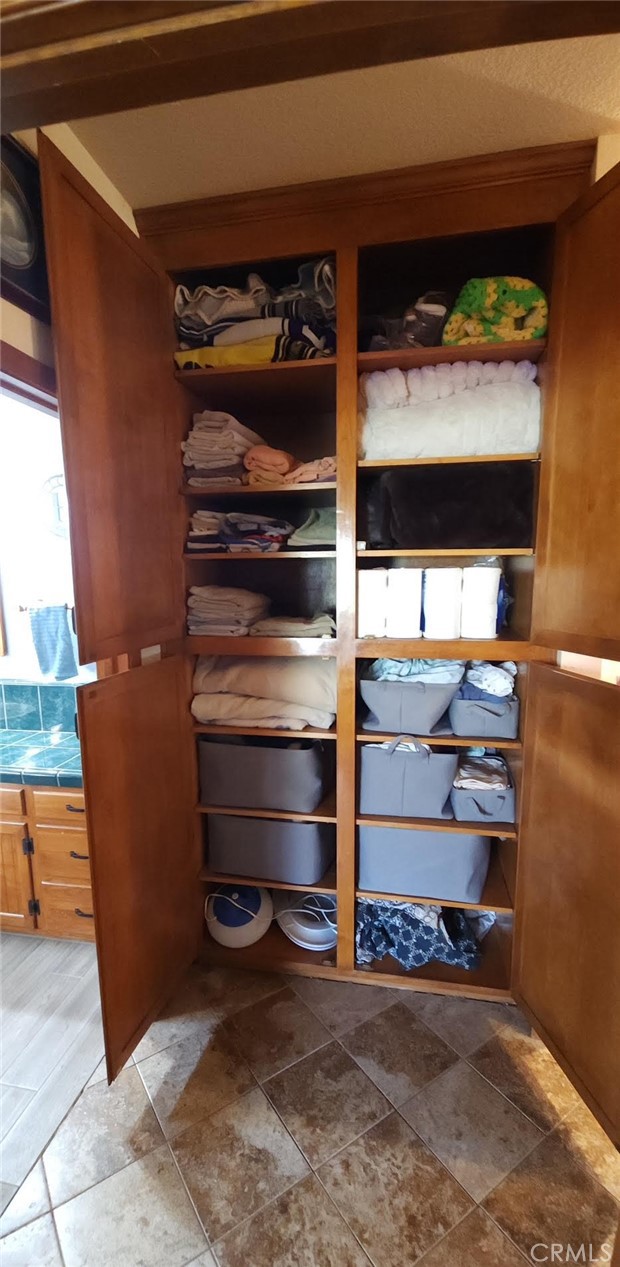 25205 5th Avenue Los Molinos, CA 96055 - Photo 23 of 37 a view of walk in closet with clothes and shoes