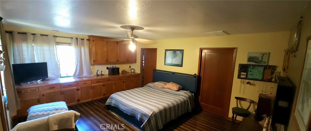 25205 5th Avenue Los Molinos, CA 96055 - Photo 27 of 37 a bedroom with a bed and a flat screen tv