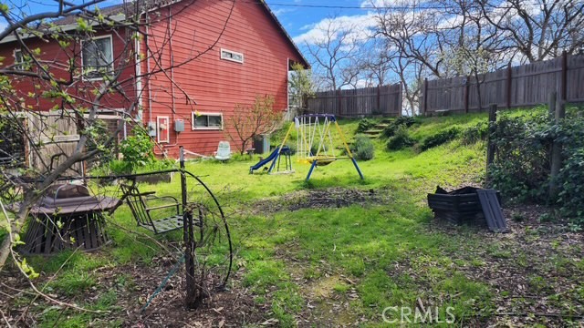 25205 5th Avenue Los Molinos, CA 96055 - Photo 4 of 37 a view of a chair and table in backyard