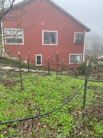 a brick building with a yard