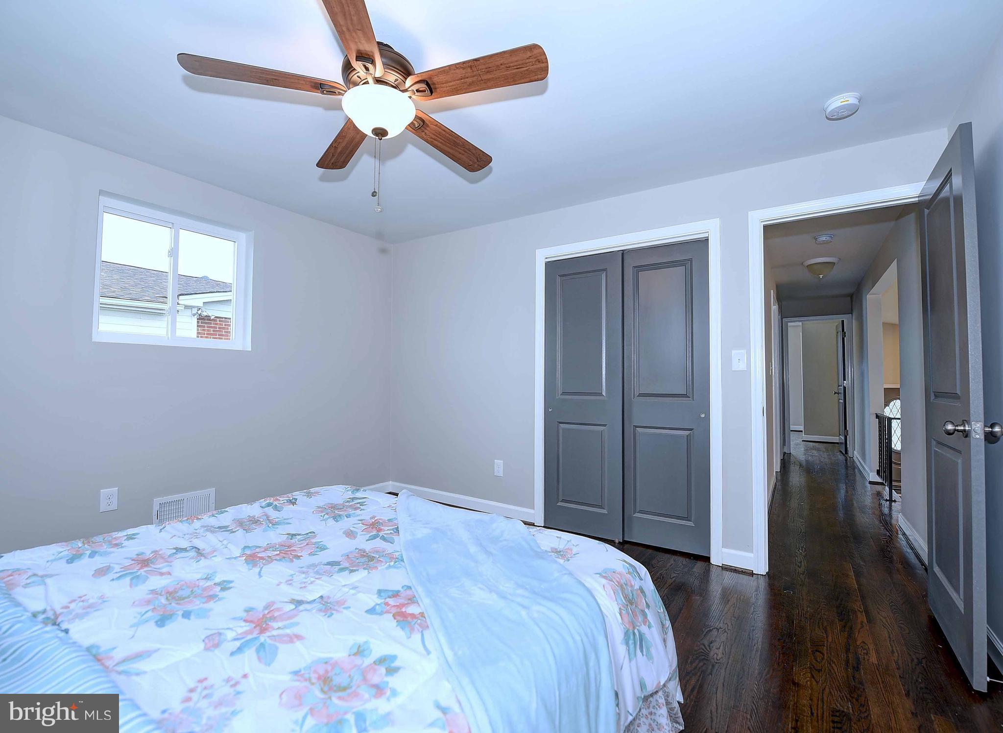 1213 Ridgeshire Road Baltimore, MD 21222 - Photo 16 of 30 a bedroom with a bed and a ceiling fan