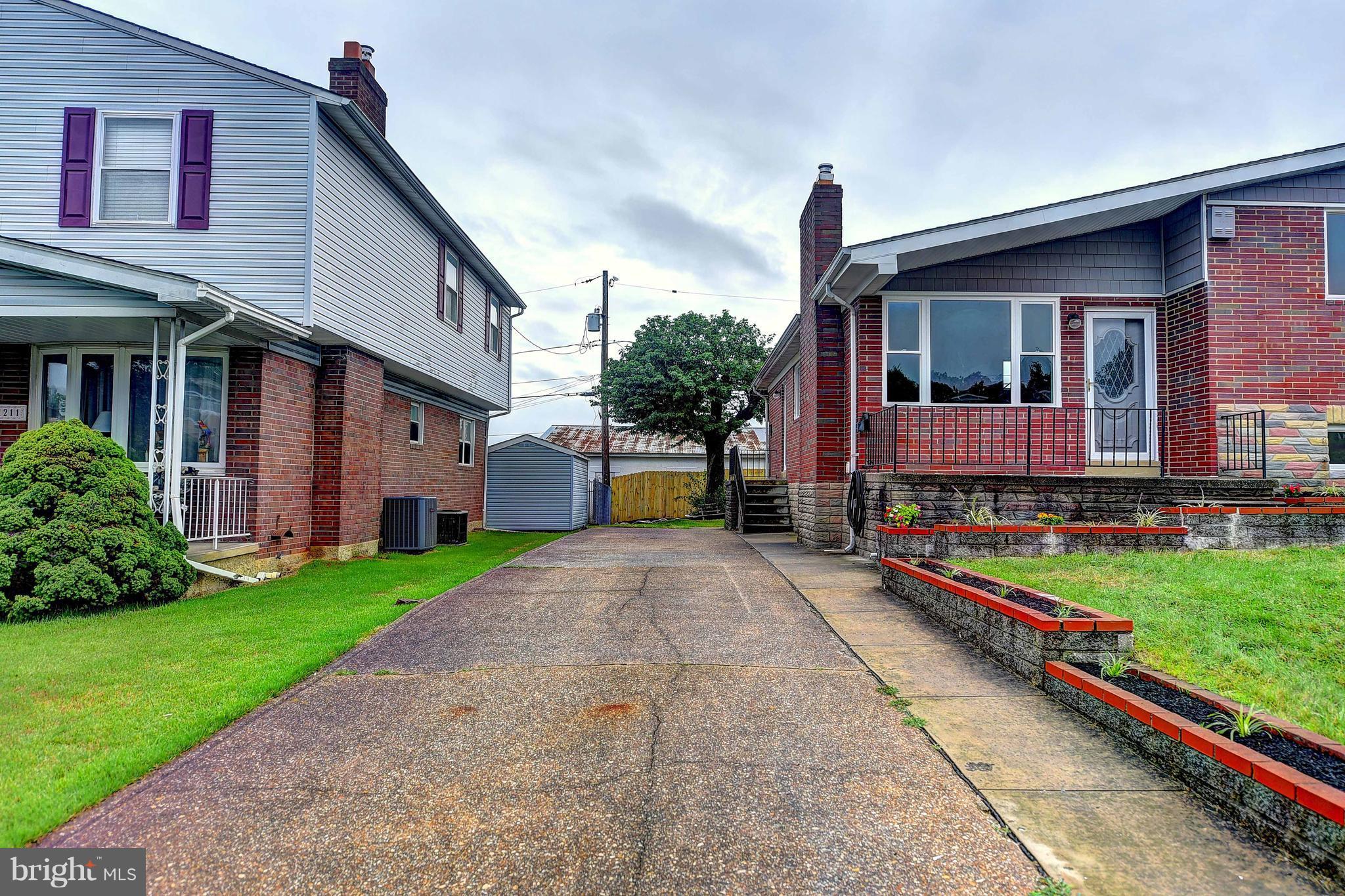 1213 Ridgeshire Road Baltimore, MD 21222 - Photo 3 of 30 a front view of house with yard