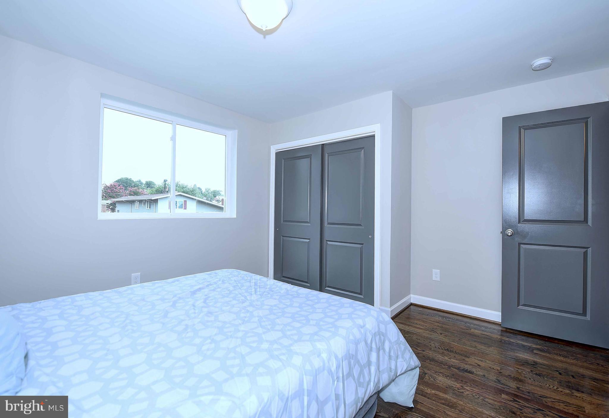 1213 Ridgeshire Road Baltimore, MD 21222 - Photo 21 of 30 a bedroom with a bed and a window