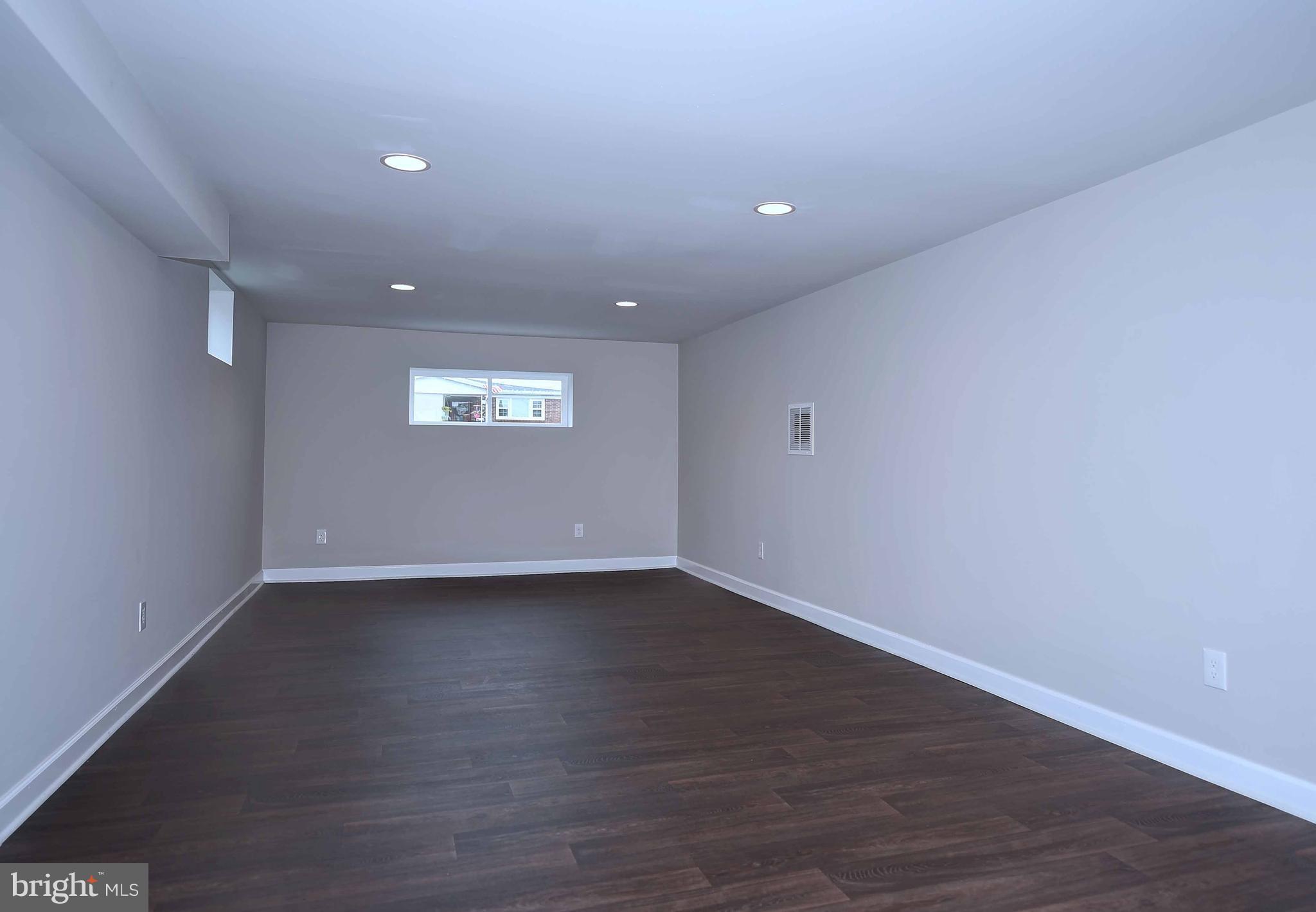 1213 Ridgeshire Road Baltimore, MD 21222 - Photo 23 of 30 a view of an empty room with a window