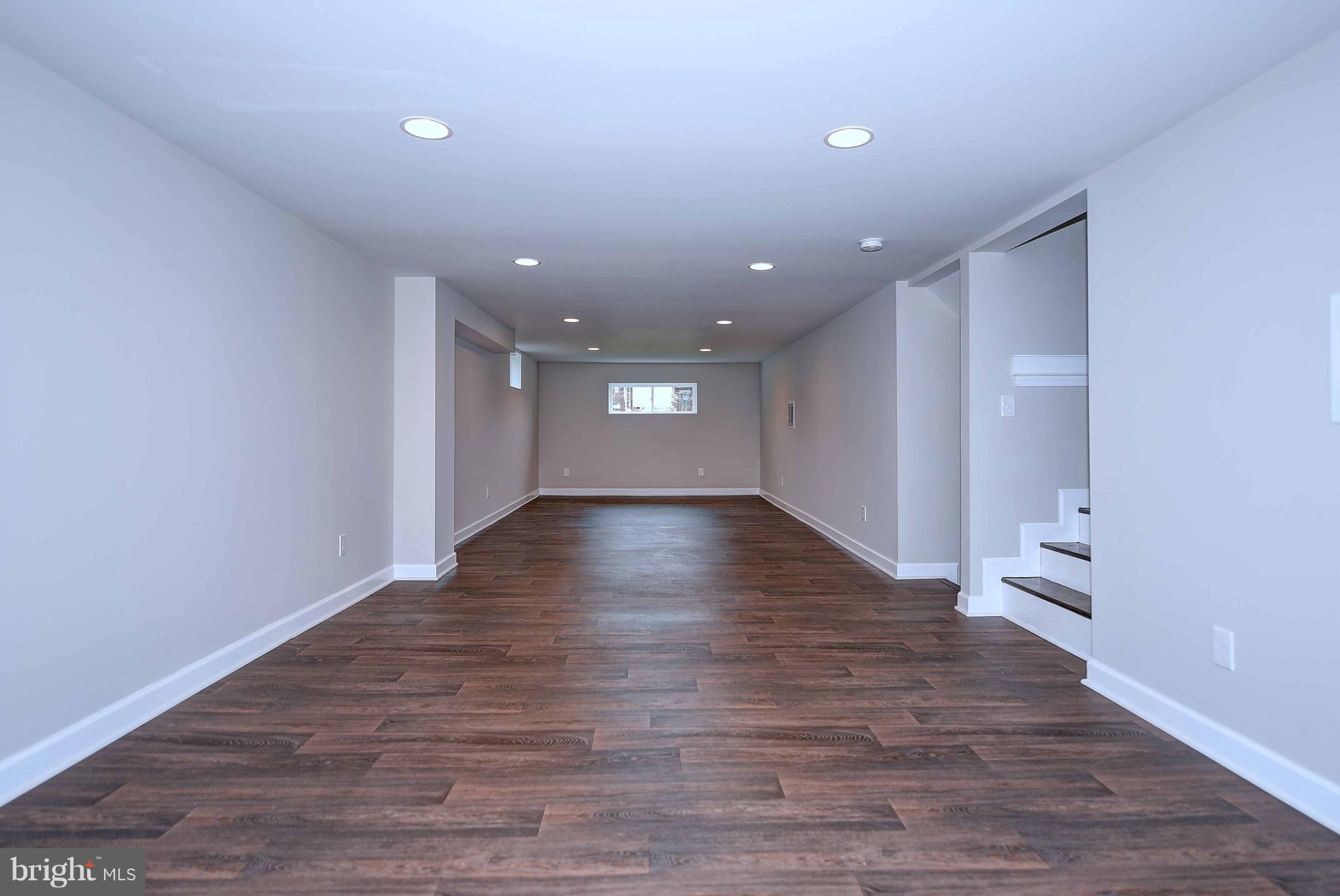 1213 Ridgeshire Road Baltimore, MD 21222 - Photo 24 of 30 a view of empty room with wooden floor