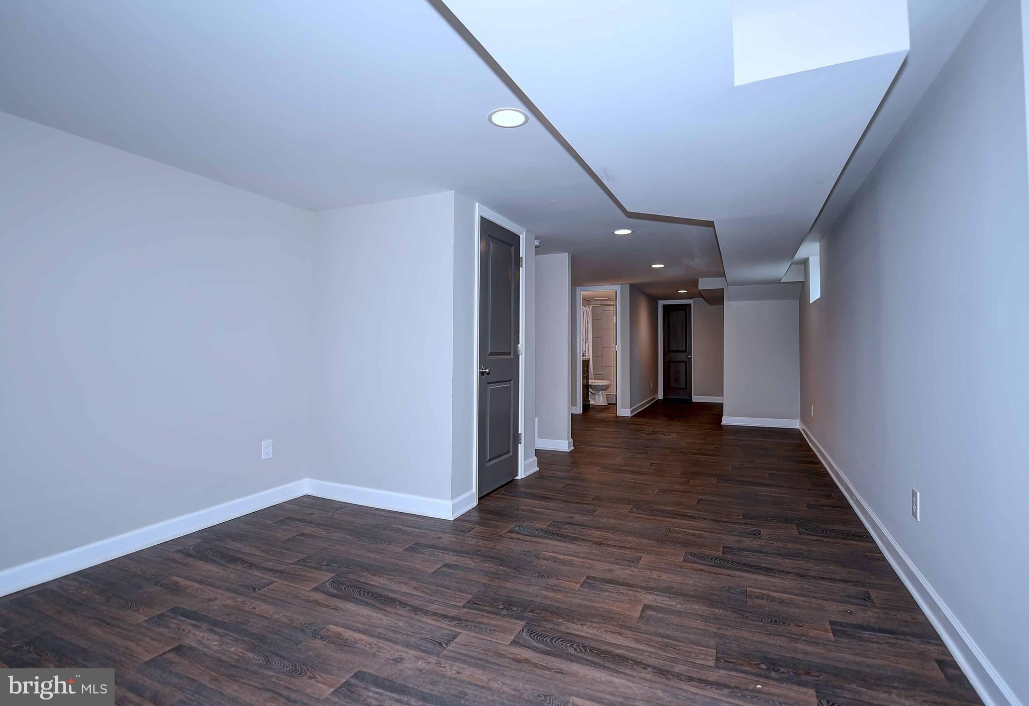 1213 Ridgeshire Road Baltimore, MD 21222 - Photo 25 of 30 a view of a hallway with wooden floor
