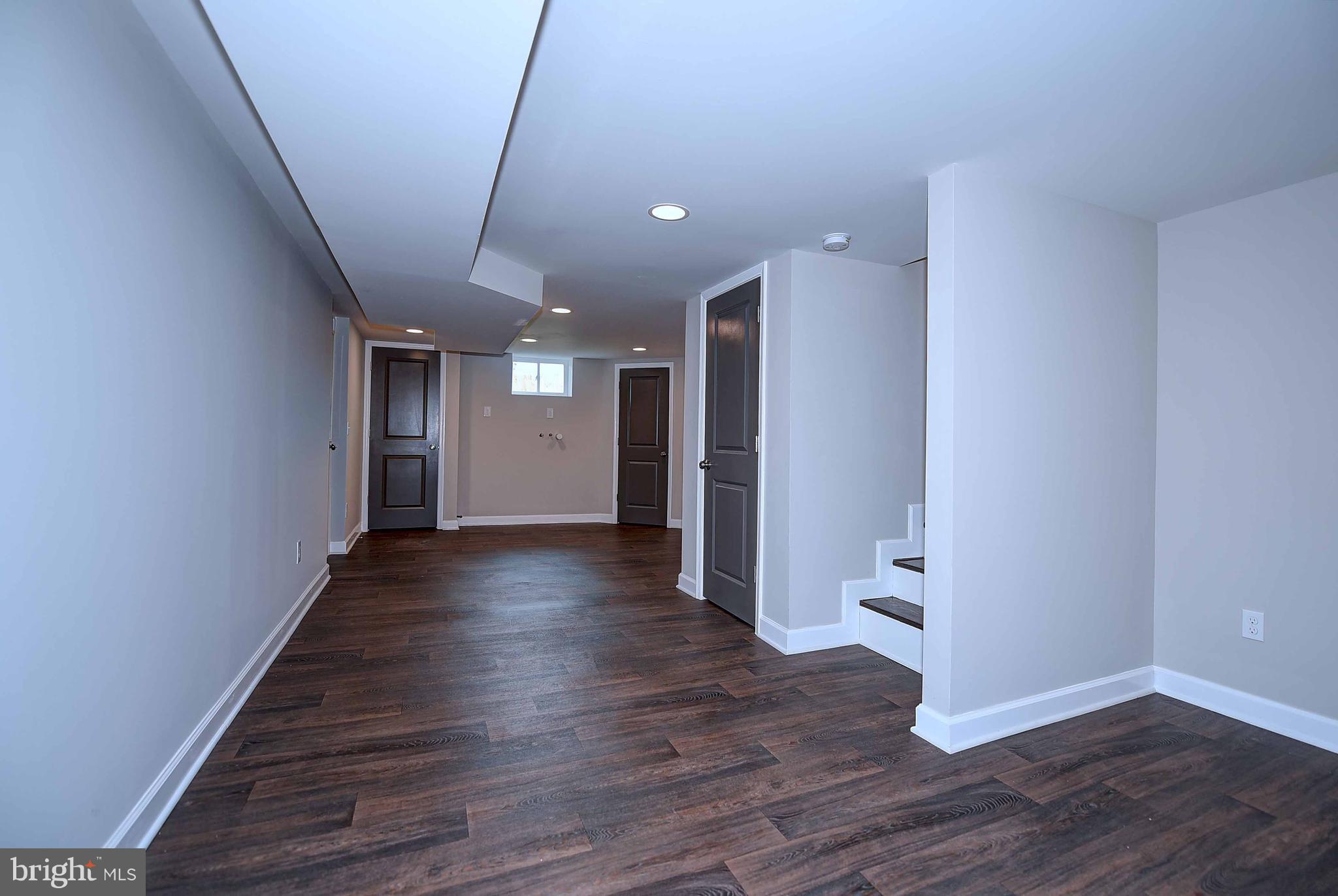 1213 Ridgeshire Road Baltimore, MD 21222 - Photo 26 of 30 a view of a hallway with wooden floor