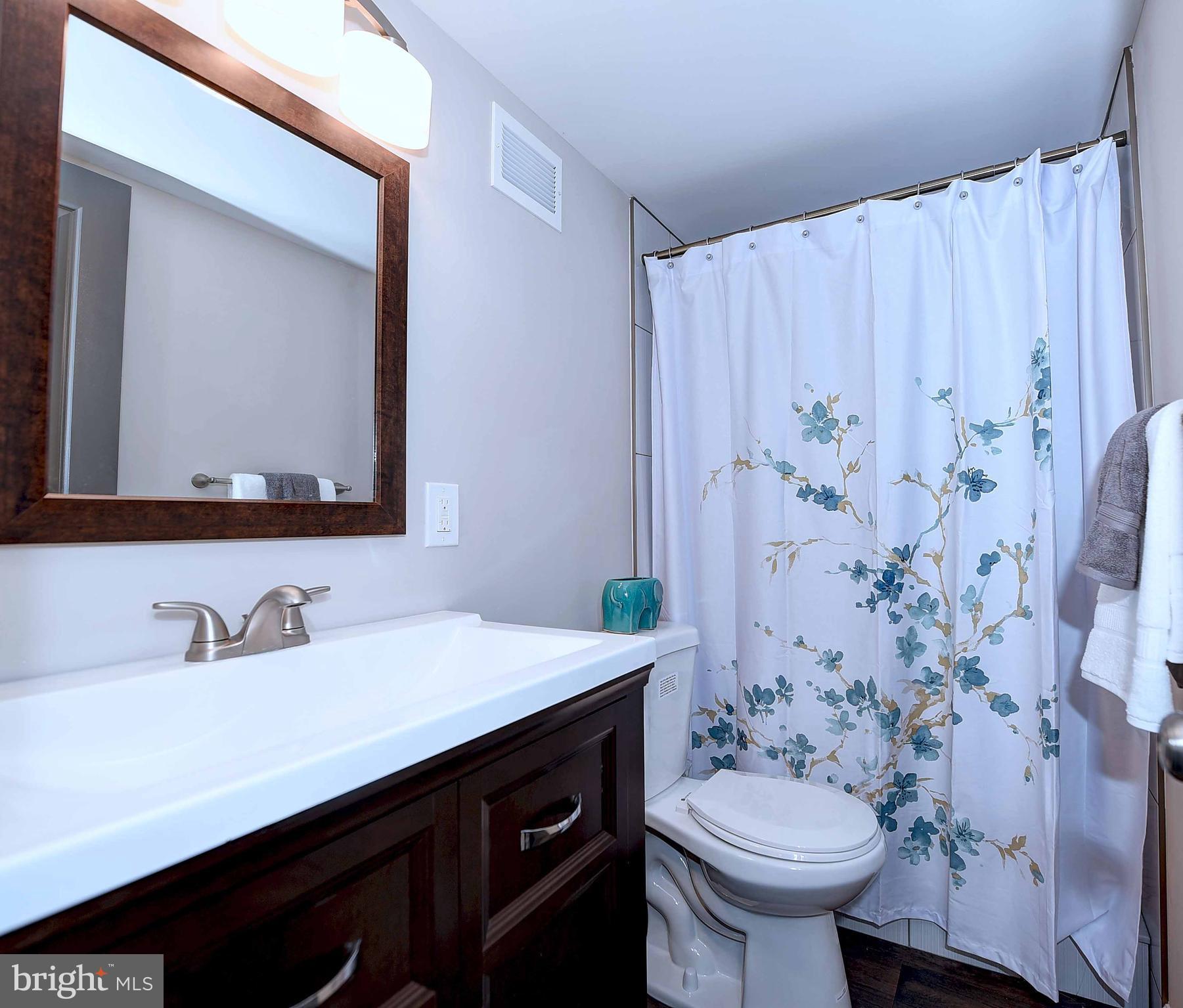 1213 Ridgeshire Road Baltimore, MD 21222 - Photo 28 of 30 a bathroom with a sink and a mirror