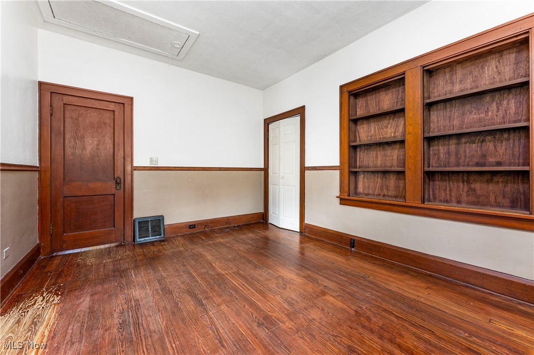 1507 Cherry Road Northwest Massillon, OH 44647 - Photo 8 of 28 Empty room with dark hardwood / wood-style flooring