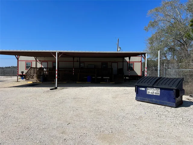 a view of a car park in front of house