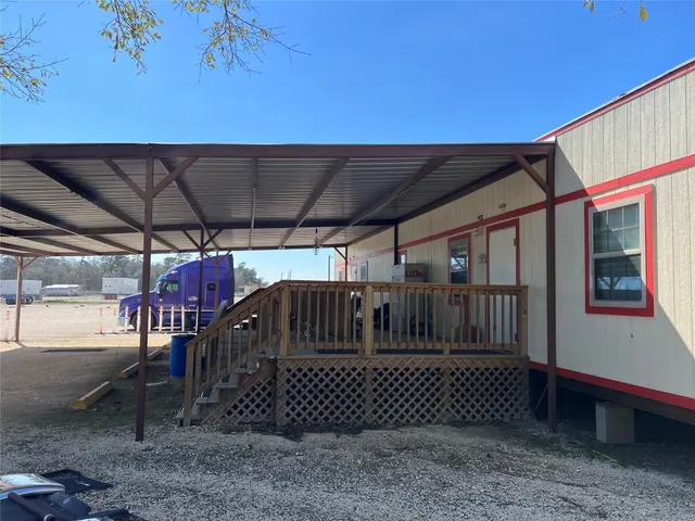 a view of porch with a wooden fence