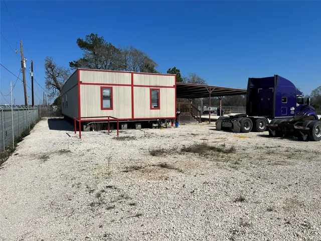 a view of a car park in front of house