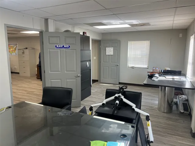 a room with furniture and wooden floor