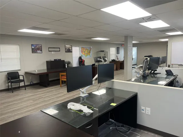 a living room with furniture a wooden floor and sink