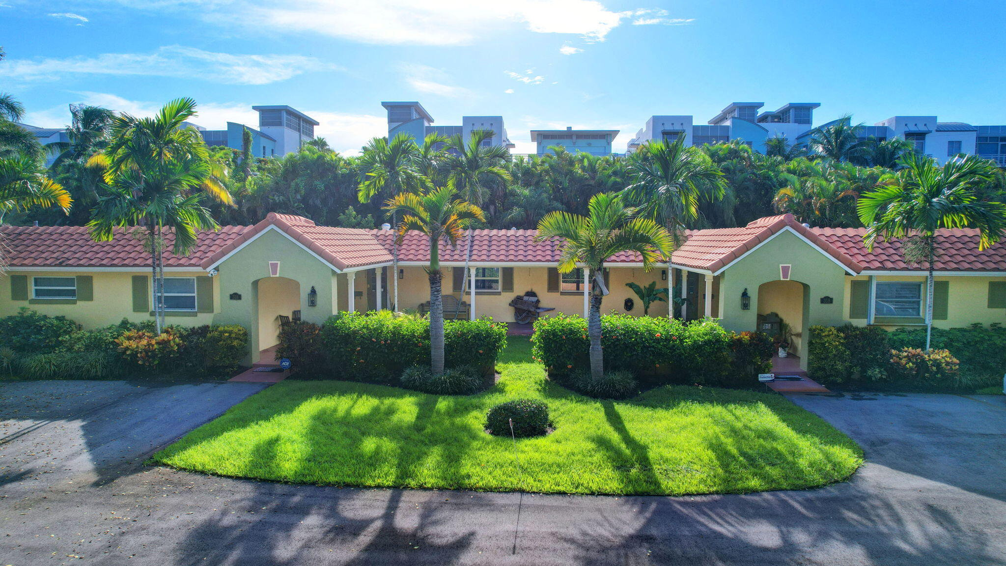 a front view of house with yard and green space