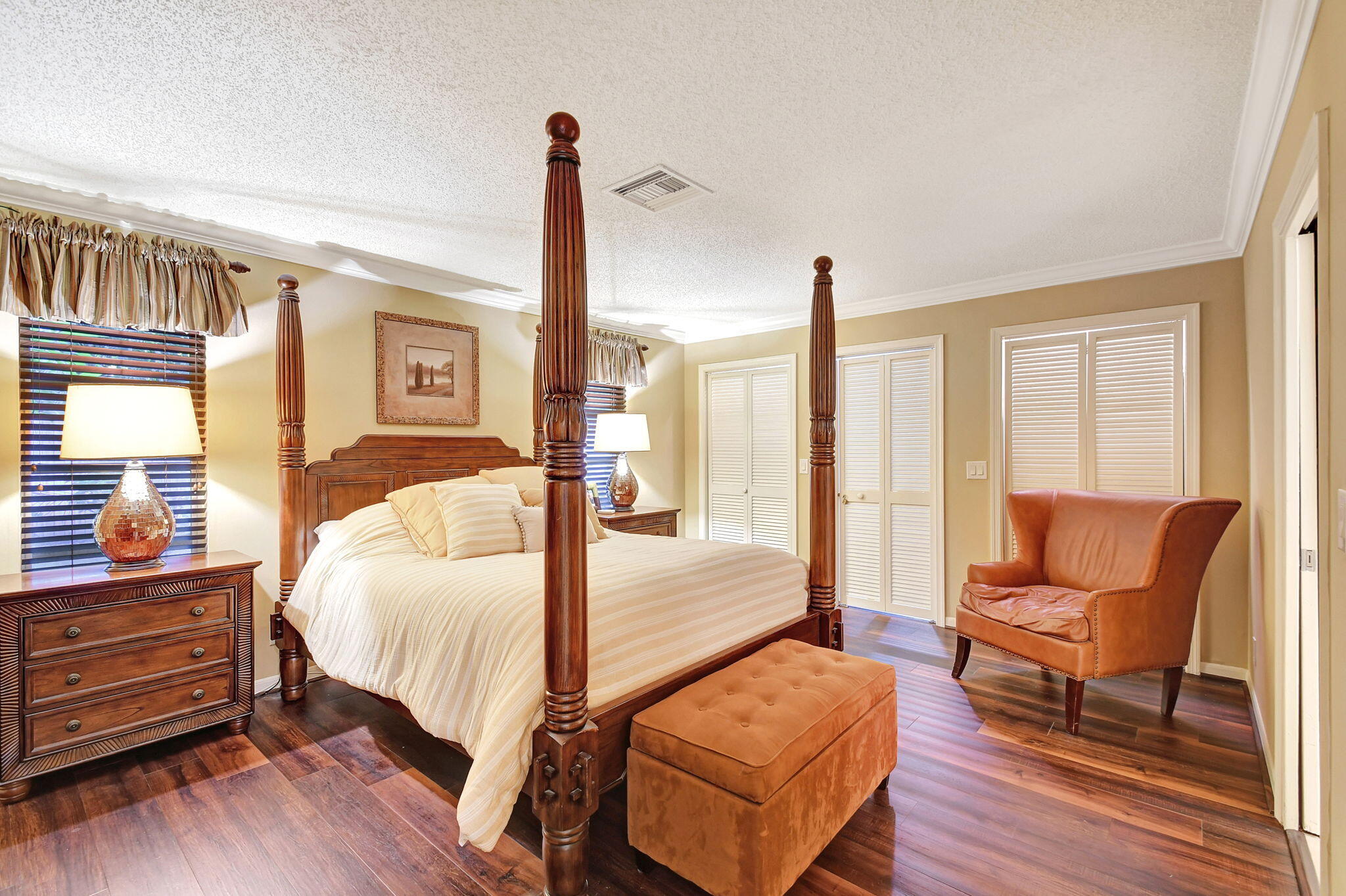 318 Southeast 7th Avenue, Unit 3 Delray Beach, FL 33483 - Photo 22 of 44 a bedroom with furniture and wooden floor