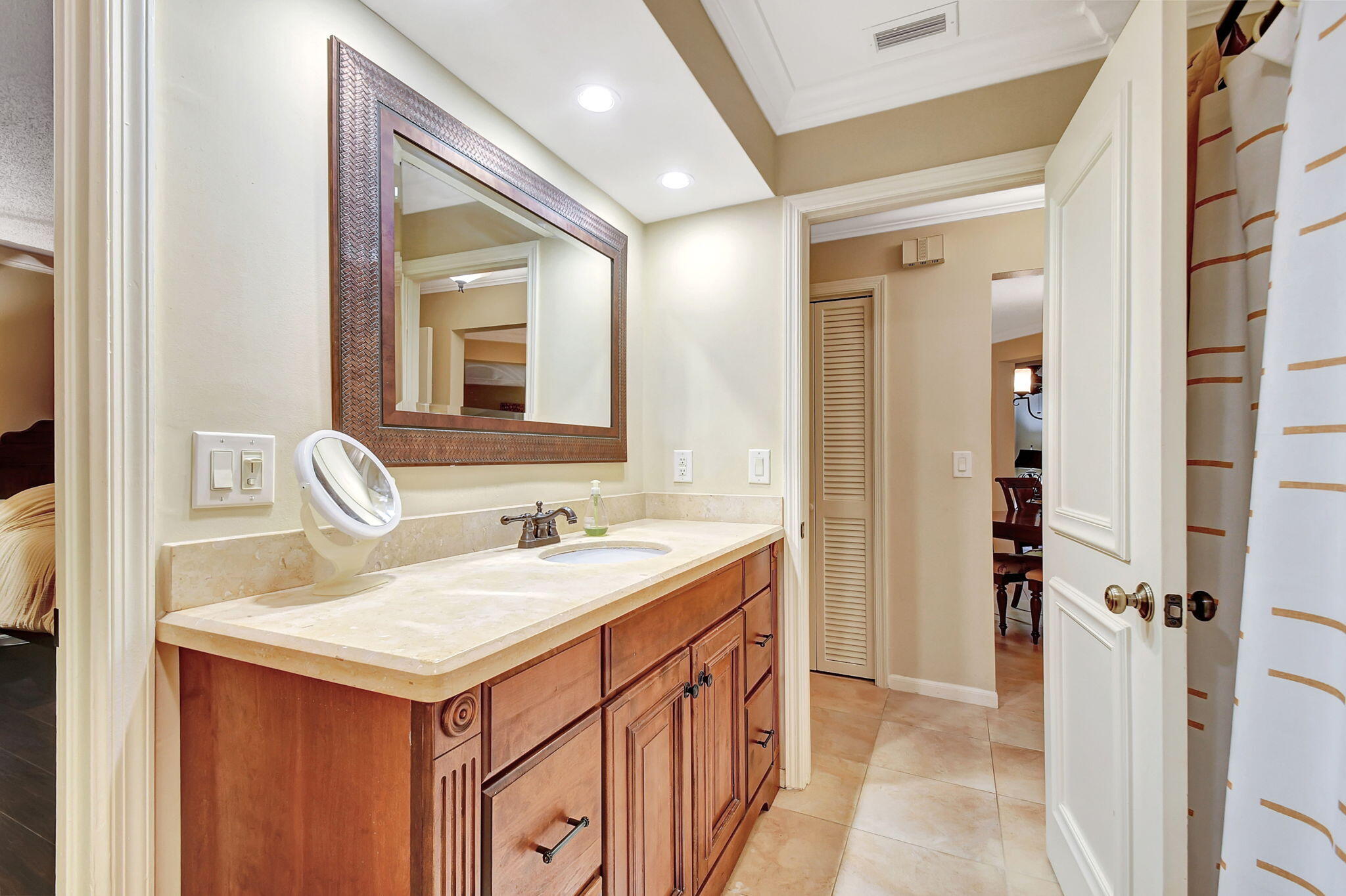 318 Southeast 7th Avenue, Unit 3 Delray Beach, FL 33483 - Photo 25 of 44 a bathroom with a sink and a mirror