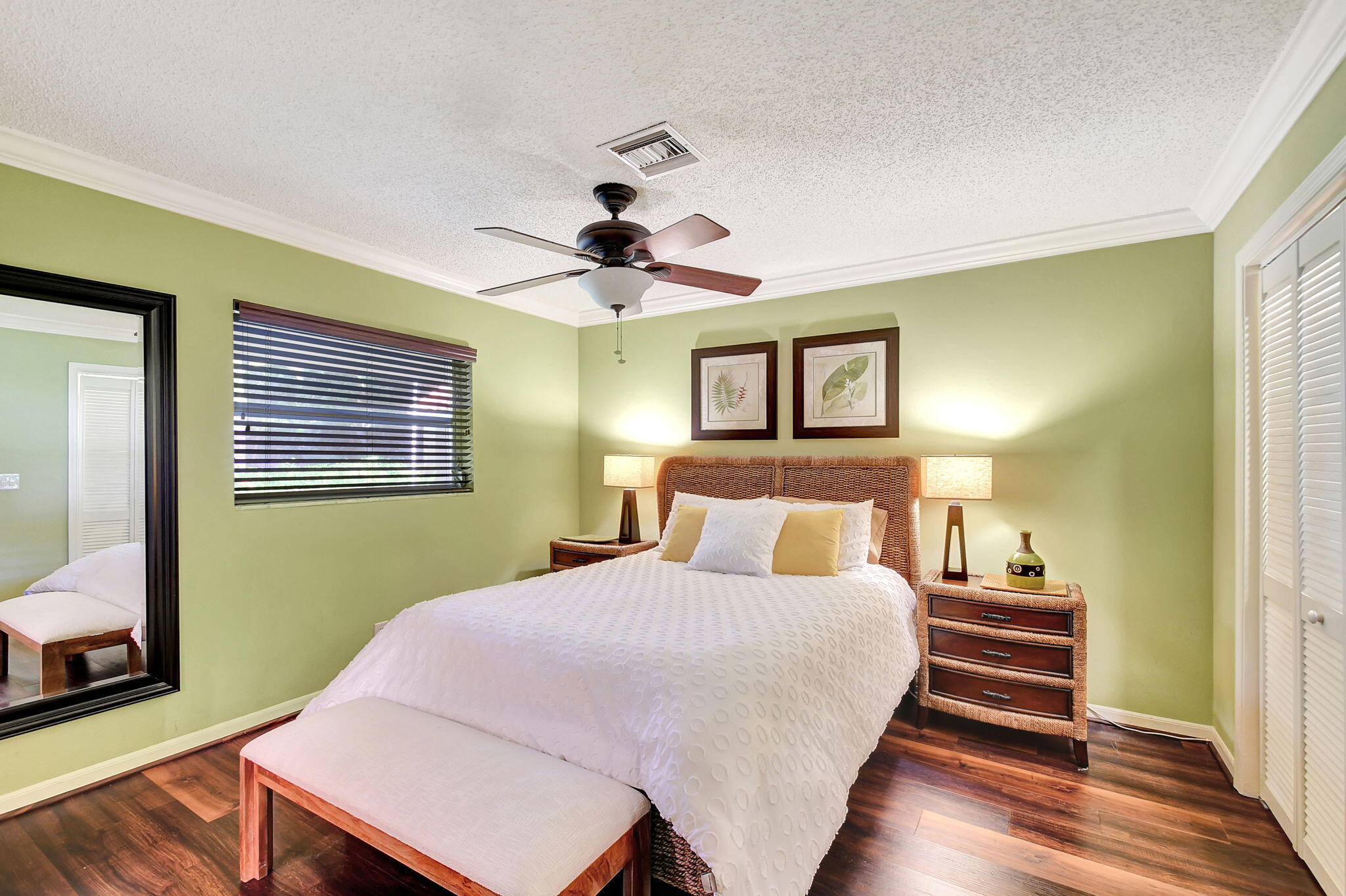 318 Southeast 7th Avenue, Unit 3 Delray Beach, FL 33483 - Photo 26 of 44 a bedroom with a bed and a dresser