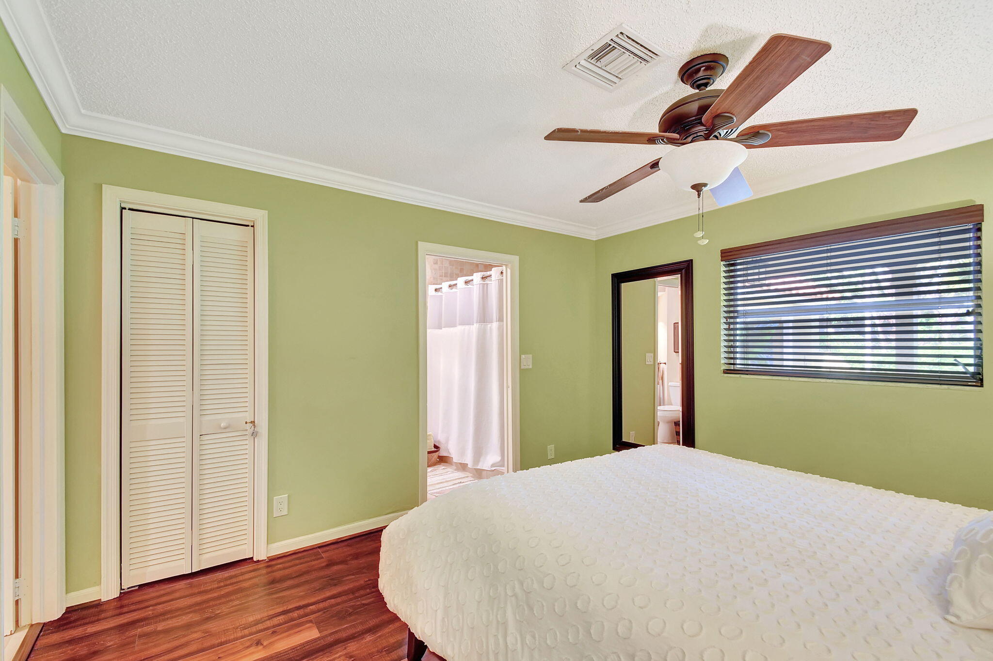 318 Southeast 7th Avenue, Unit 3 Delray Beach, FL 33483 - Photo 27 of 44 a bedroom with a bed and a window