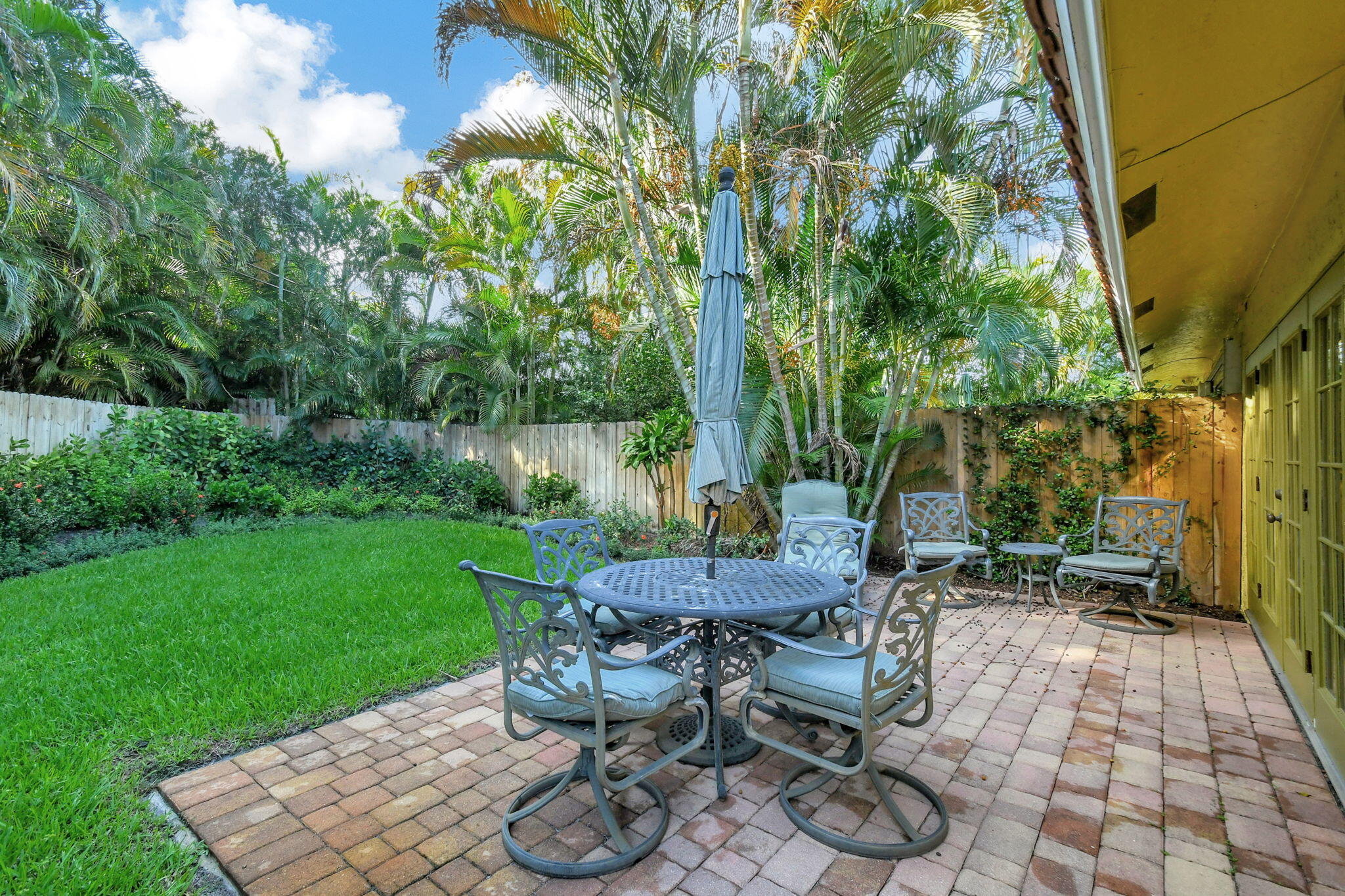 318 Southeast 7th Avenue, Unit 3 Delray Beach, FL 33483 - Photo 29 of 44 a view of a backyard with sitting area