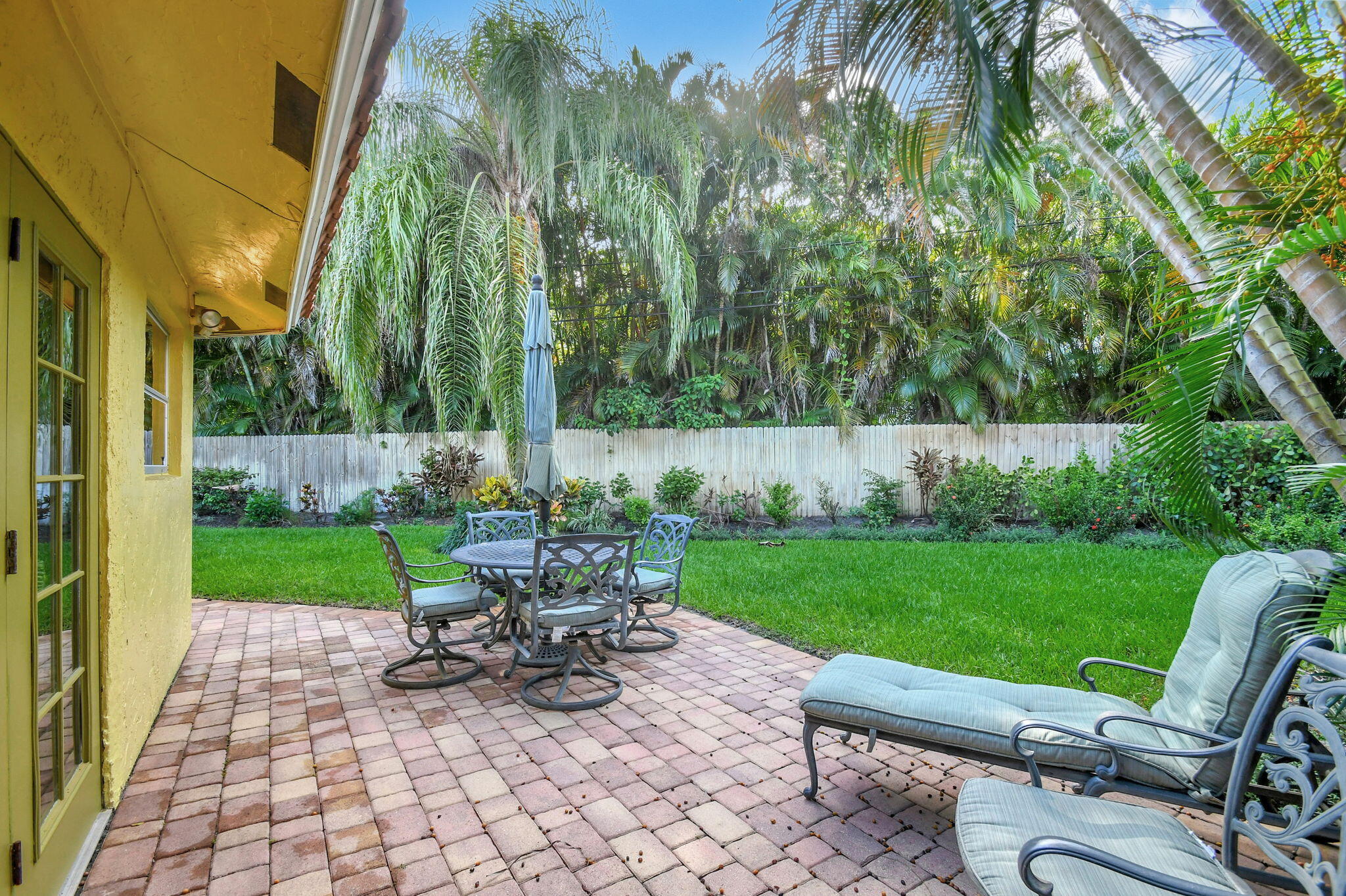 318 Southeast 7th Avenue, Unit 3 Delray Beach, FL 33483 - Photo 30 of 44 a view of a chair and table in the garden