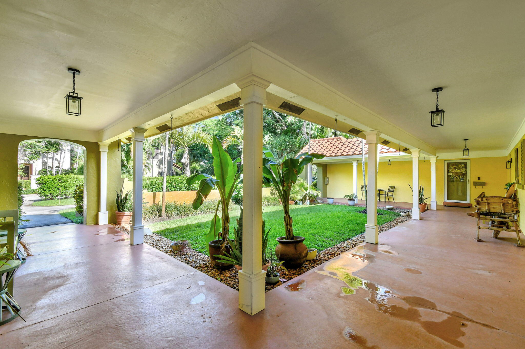 318 Southeast 7th Avenue, Unit 3 Delray Beach, FL 33483 - Photo 5 of 44 a view of a porch with furniture and garden