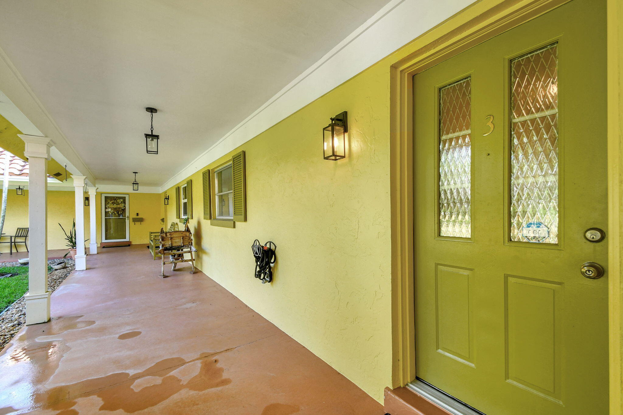318 Southeast 7th Avenue, Unit 3 Delray Beach, FL 33483 - Photo 6 of 44 a view of a hallway with wooden floor and furniture
