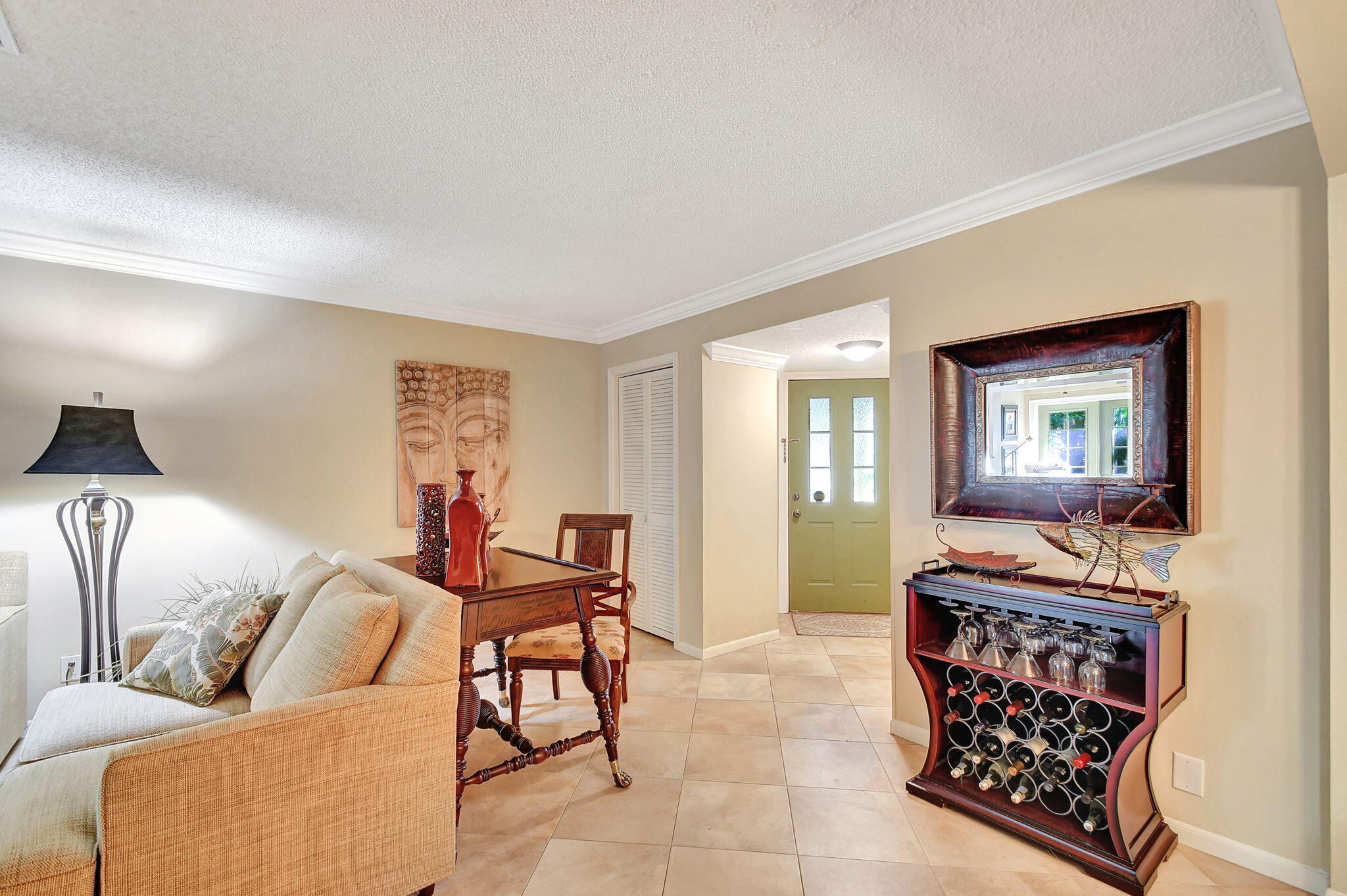 318 Southeast 7th Avenue, Unit 3 Delray Beach, FL 33483 - Photo 9 of 44 a living room with furniture and a flat screen tv