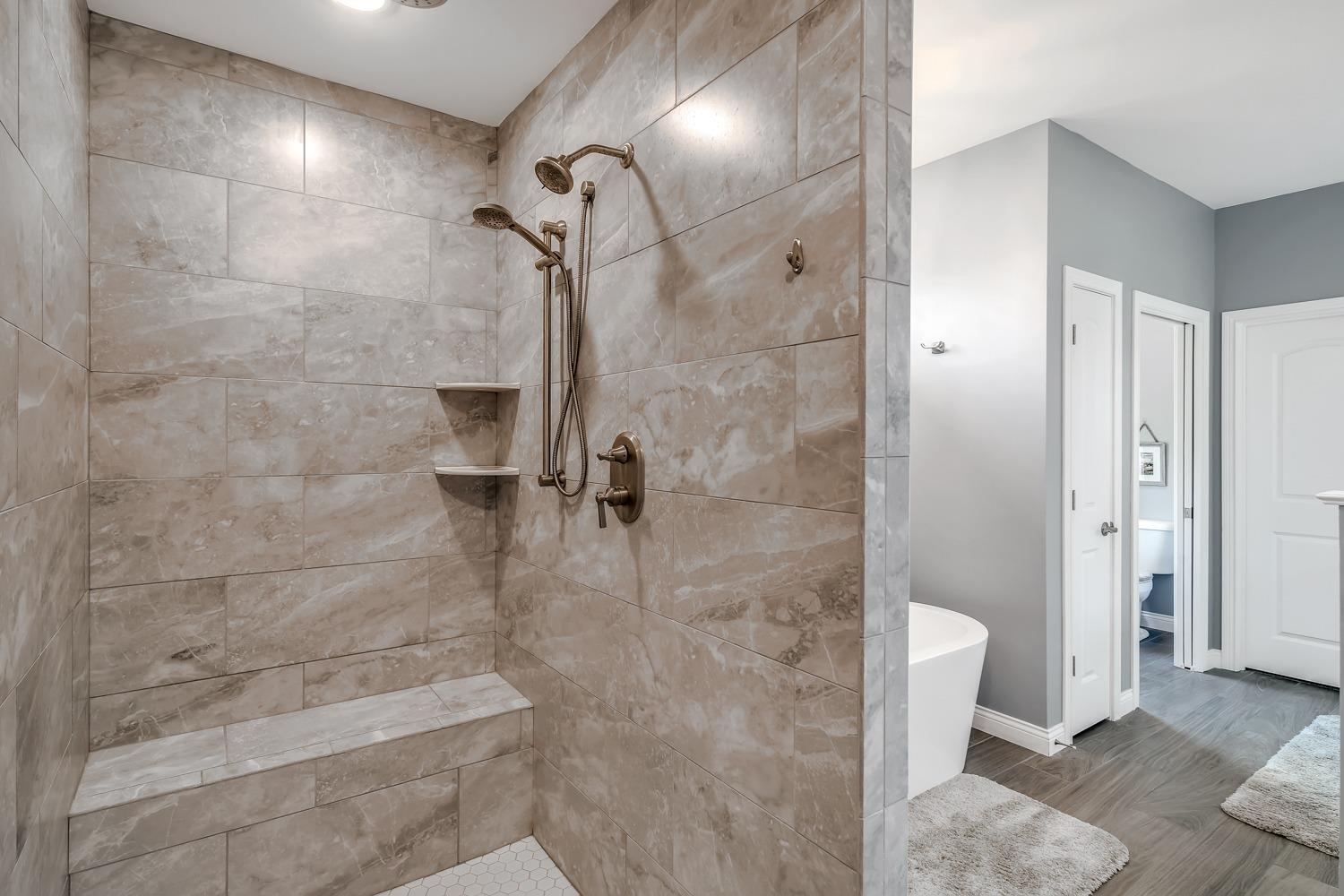 588 Madison Rdg Road Lawrenceburg, IN 47025 - Photo 32 of 71 The shower comes complete with a built in seat and multiple shower heads (including a rain head) - it's an owners dream!