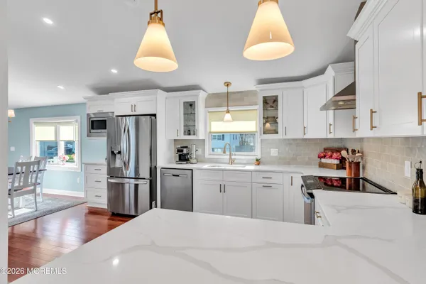 a kitchen with refrigerator and window