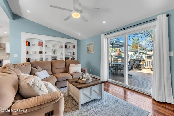 a bedroom with bed and a chandelier