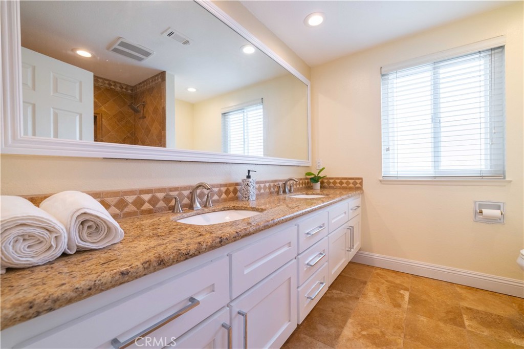 4759 Cll Estrada La Verne, CA 91750 - Photo 26 of 36 a bathroom with a granite countertop double vanity sink and mirror