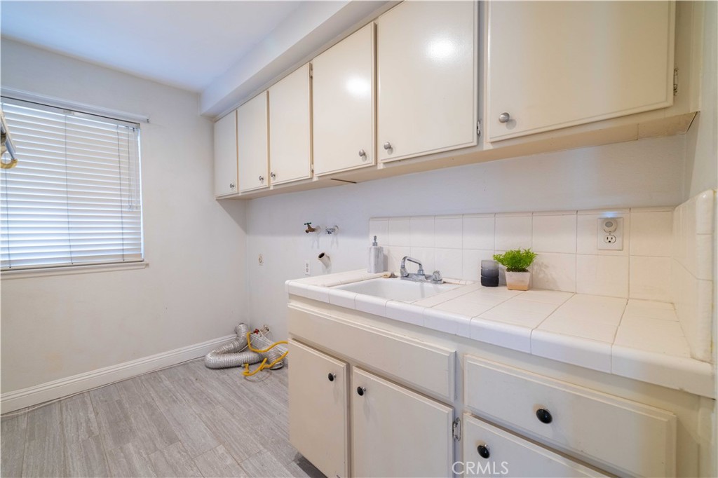 4759 Cll Estrada La Verne, CA 91750 - Photo 33 of 36 a kitchen with a sink cabinets and a window