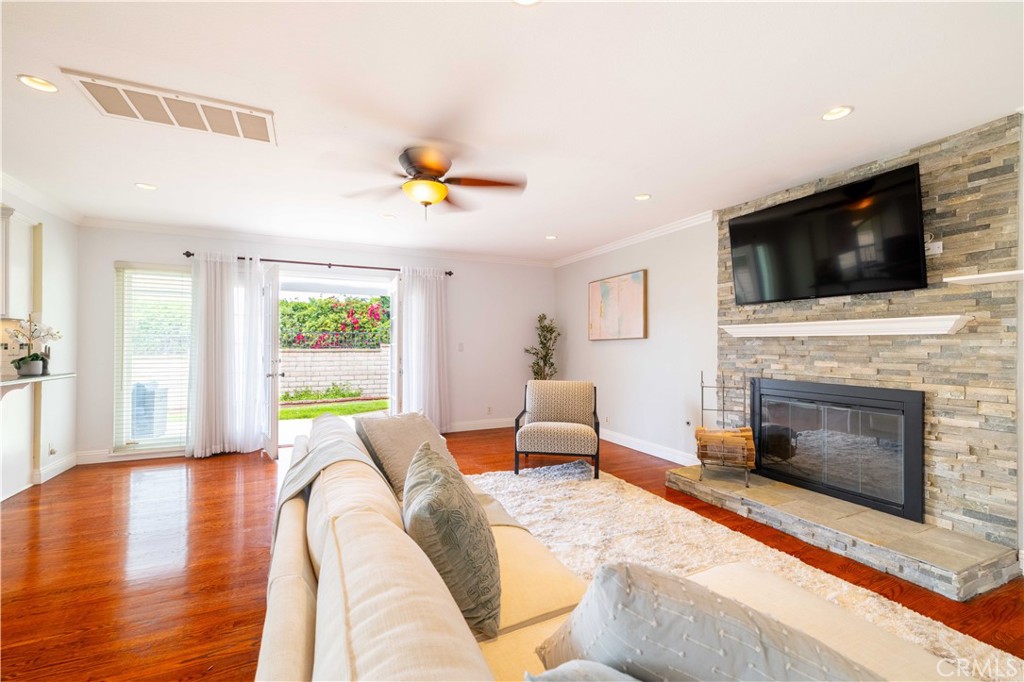 4759 Cll Estrada La Verne, CA 91750 - Photo 9 of 36 a living room with furniture a fireplace and a flat screen tv