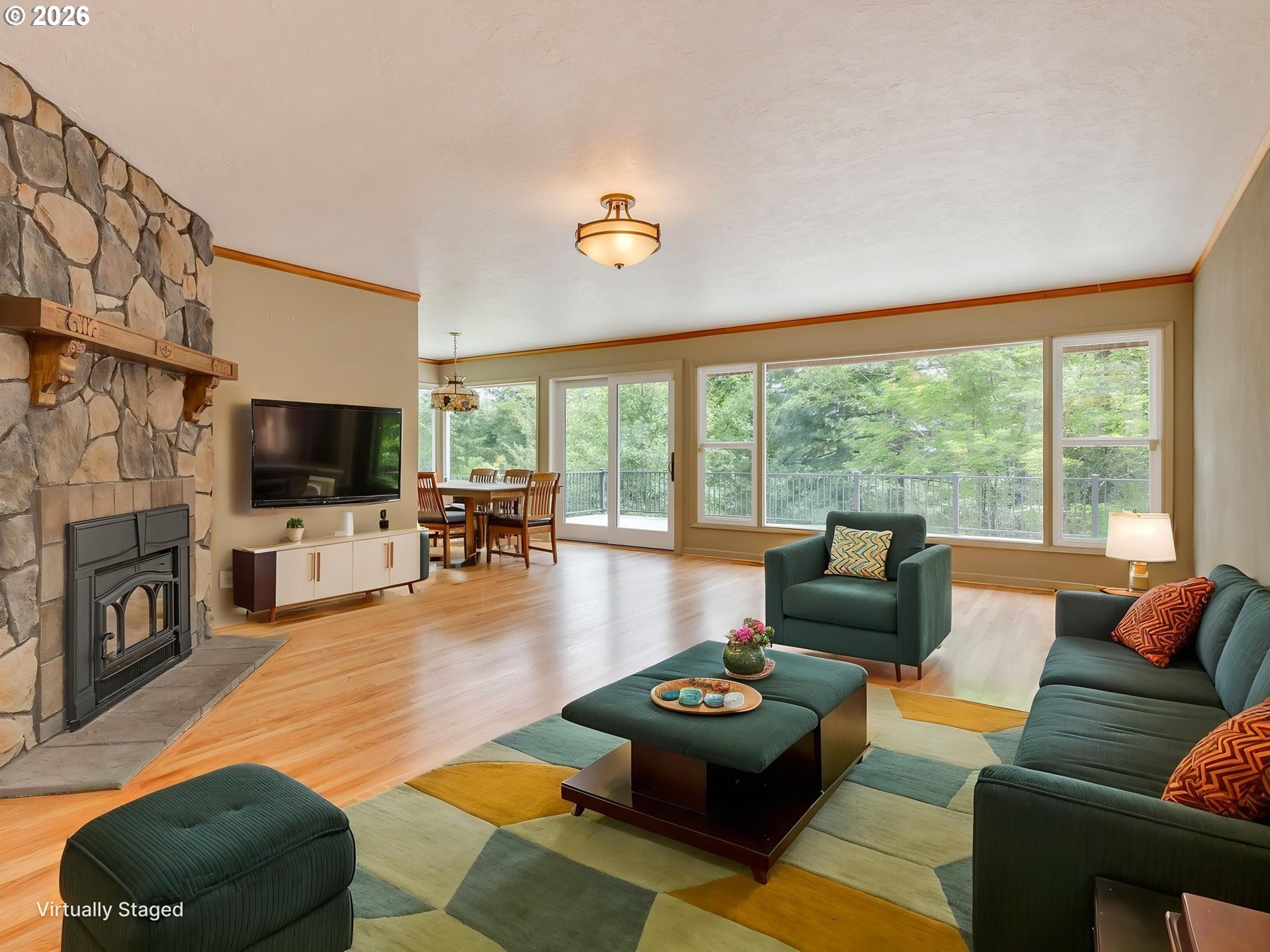48140 Southeast Linhart Butte Road Sandy, OR 97055 - Photo 11 of 47 a living room with furniture and a flat screen tv