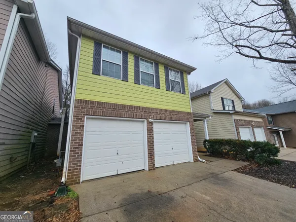 a house view with a backyard space