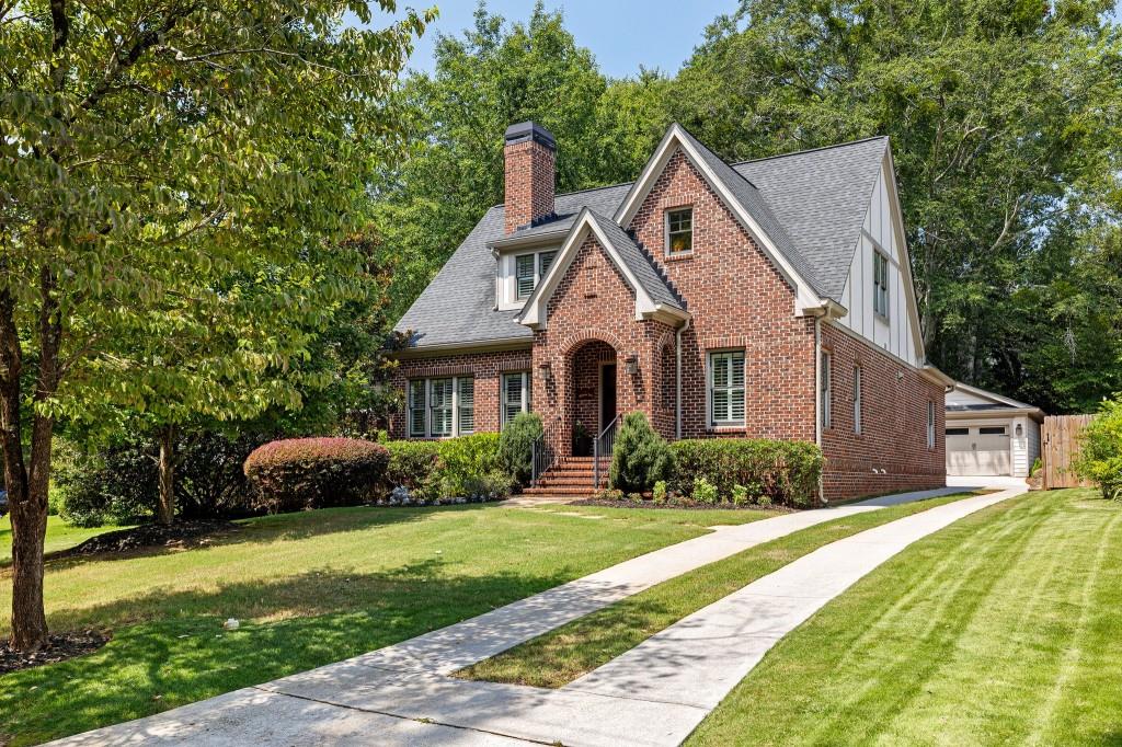 315 Missionary Drive Decatur, GA 30030 - Photo 1 of 1 a front view of a house with a yard and garage